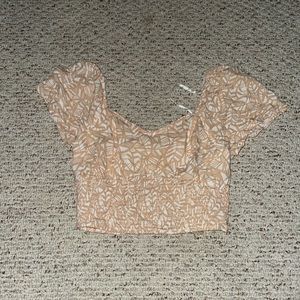 Tan and white cropped shirt with ruffle sleeves size large